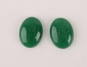 TWO SMALL OVAL GREEN JADE GEMS