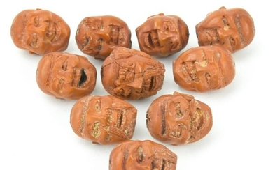 Ten Antique Chinese Hand Carved Peach Pit Beads