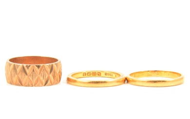 Three gold wedding rings.