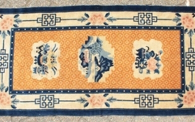 A CHINESE WOOL RUG with three main motifs with blue and
