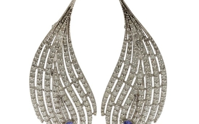 A pair of tanzanite and diamond ear pendants each set with an oval-cut tanzanite and numerous brilliant-cut diamonds, mounted in 18k white gold. L. 5.3 cm. (2)