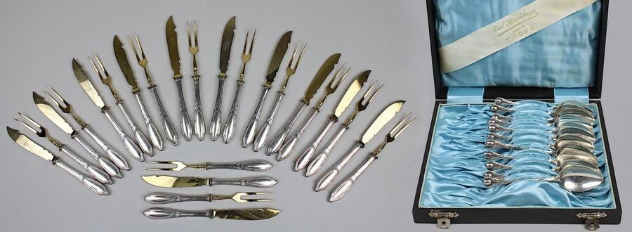12 mocha spoons and a fruit cutlery set, silver plated, German 2nd half of the 19th century, the mocha spoons with twig handles and leaf-shaped monkeys, each one punched: Gulden, signet and 12, the fruit cutlery in art nouveau style with foliage and...