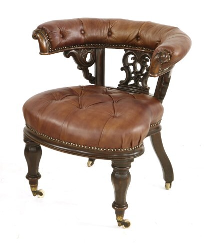 An early Victorian mahogany and leather button upholstered chair