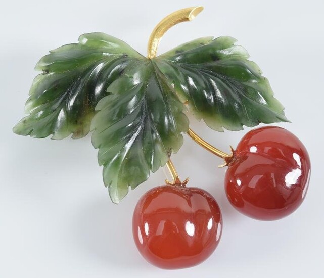 18K Austrian gold cherry form pin. Carved jade leaves.