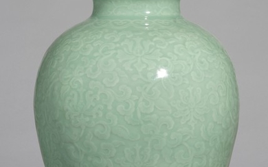 A FINE AND RARE MOULDED CELADON-GLAZED 'LOTUS' JAR SEAL MARK AND PERIOD OF QIANLONG