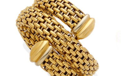 An 18k bi-color gold coil bangle bracelet