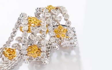 A diamond and coloured diamond bracelet Composed of...