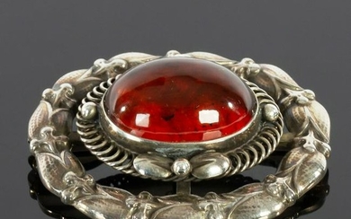 George Jensen, a Danish silver and amber brooch, no.
