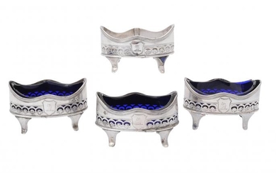 A set of four George III silver oval salt cellars by Henry Chawner