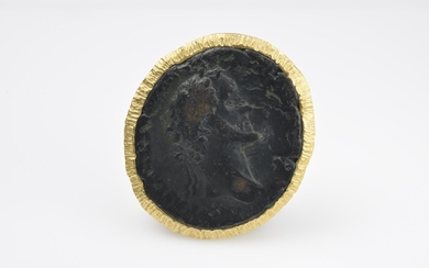 An 18/24k gold brooch with an antique bronze coin