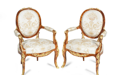 A pair of French late 19th century tulipwood and gilt metal mounted fauteuils