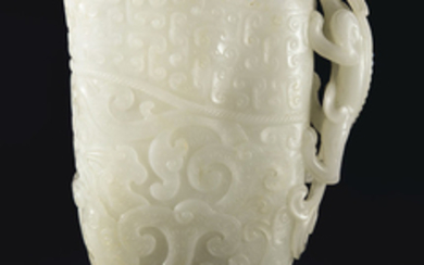 A FINELY CARVED WHITE JADE ARCHAISTIC RHYTON, CHINA, QING DYNASTY, 17TH-18TH CENTURY