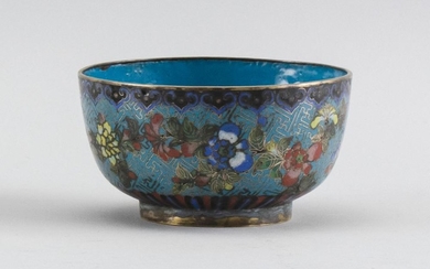 CHINESE CLOISONNÉ ENAMEL BOWL With gilt rim, turquoise interior and colorful exterior decoration of a floral design on a turquoise g...
