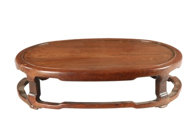 A 19TH CENTURY CHINESE HARDWOOD OVAL SHAPED JARDINIERE STAND...
