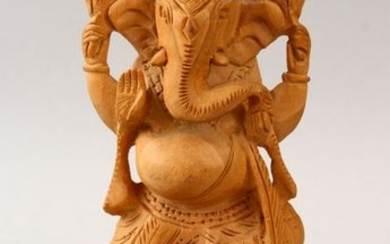 A 20TH CENTURY CARVED WOODEN INDIAN FIGURE OF GANESH