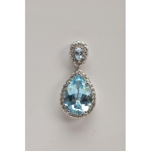 A 9CT WHITE GOLD, BLUE TOPAZ AND SPINEL PENDANT, designed wi...
