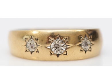 A 9ct gold and three stone diamond illusion star set ring, L...