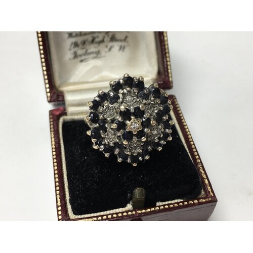 A 9ct gold sapphire and diamond set dress ring, 6.4g