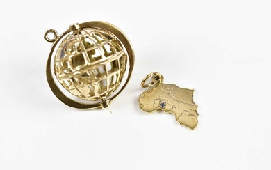 A 9ct yellow gold pierced globe charm and a further...