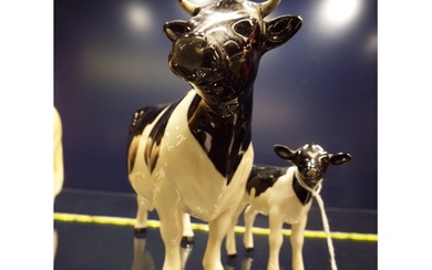 A Beswick Claybury Friesian cow and calf