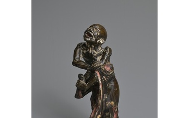 A CHINESE HEAVILY CAST BRONZE MODEL OF A LUOHAN, 17/18TH CEN...