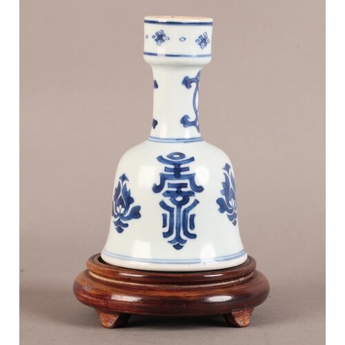 A CHINESE PORCELAIN BELL SHAPED VASE with unglazed shallow f...