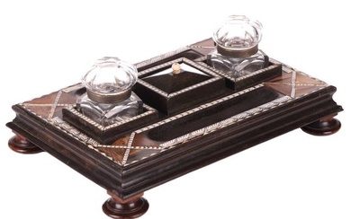 A Ceylonese ebony desk stand with calamander, coconut palm, and rosewood parquetry within pen-worked