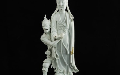 A Chinese Dehua blanc-de-chine group figure, 18th century