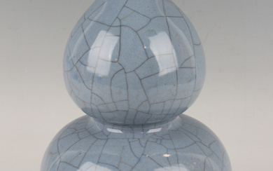 A Chinese Guan-type blue crackle glazed stoneware double gourd shaped vase, mark of Qianlong but pro