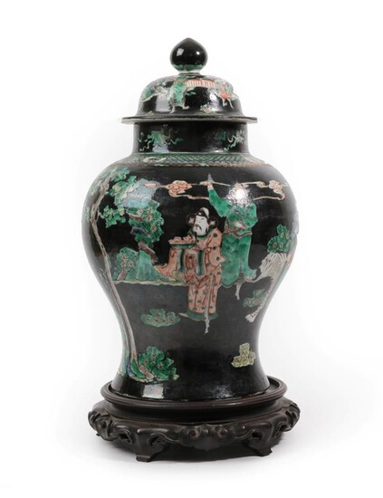 A Chinese Porcelain Baluster Jar and Cover, 19th century, painted in famille noire enamels with...