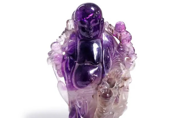 A Chinese amethyst rock crystal carving of Budai Qing dynasty, 18th/19th century...