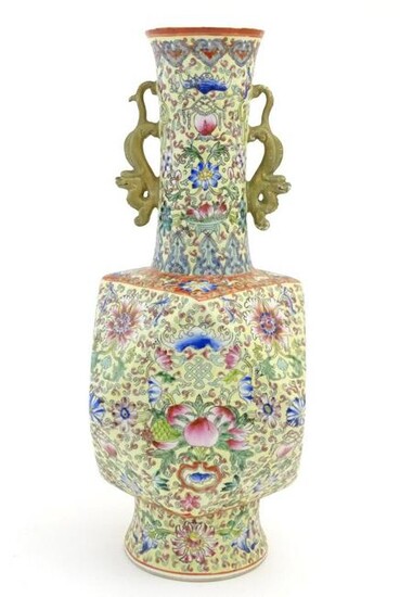 A Chinese famille jaune vase with twin handles modelled