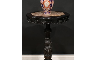 A Chinese hardwood tripod porcelain table, octofoil top with...