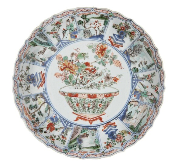 A Chinese porcelain moulded dish, Kangxi period, painted in famille...