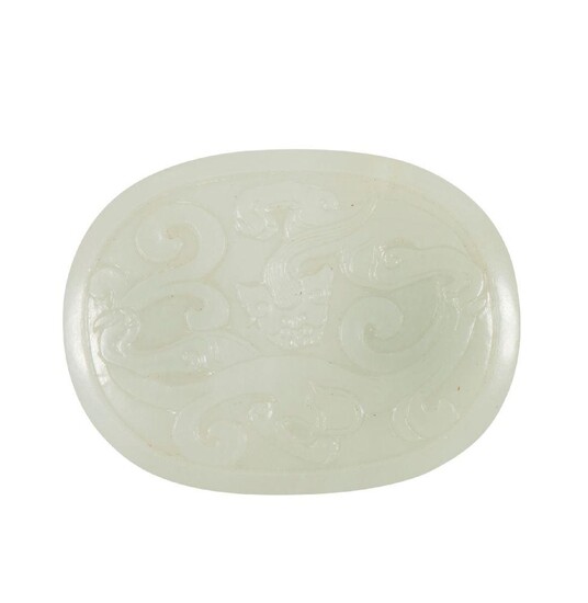 A Chinese white jade buckle, 18th century, the top carved...