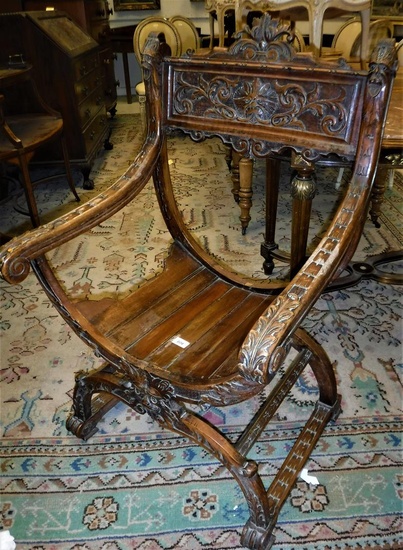 A Continental walnut framed hall chair on a shaped...