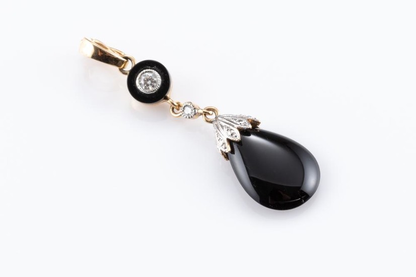 A DECO STYLE ONYX AND DIAMOND ENHANCER; featuring a drop shape onyx surmounted by a line drop set with an onyx disc and 2 round bril...