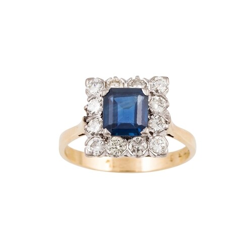 A DIAMOND AND SAPPHIRE CLUSTER RING, the trap cut sapphire t...