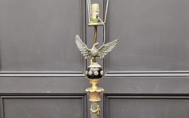 A French Empire style ebonized and brass table lamp, he...