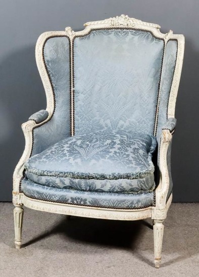 A French Off-White Painted Carved Beechwood Wingback Easy Chair...