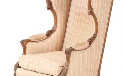 A French circa 1900 walnut bergere, upholstered with rose furniture fabric, carved...