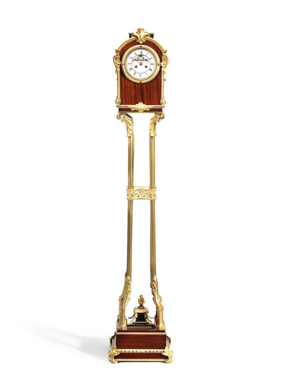 A French late 19th century mahogany and gilt bronze mounted clock together with a gilt bronze stand