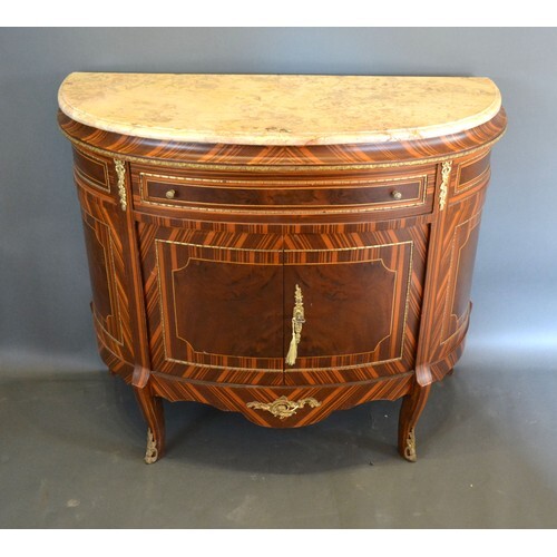 A French style demi-lune side cabinet, the variegated marble...