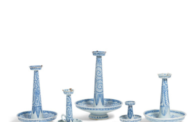 A GROUP OF FIVE BLUE AND WHITE CANDLESTICKS 19th Century...