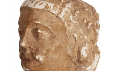 A Gandharan stucco head of a moustachioed...