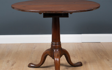A George III mahogany circular tilt top occasional table