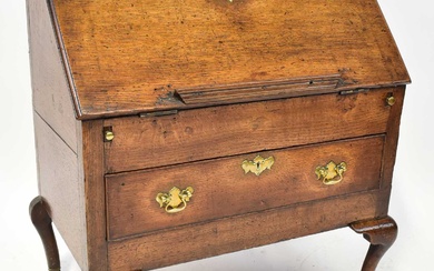 A George III oak bureau of small proportions, with fitted...