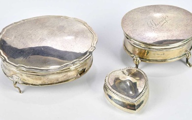 A George V hallmarked silver jewellery box of oval form,...