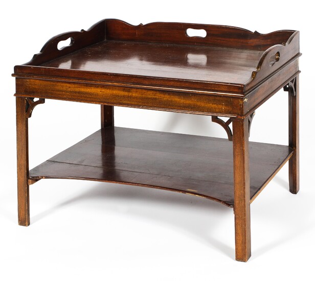 A Georgian mahogany butler's tray table, with pierced handles and scroll gallery