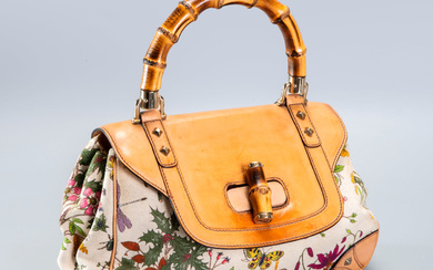 A Gucci Limited Edition Beige Leather & Floral Print Canvas...